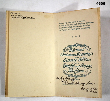 Inside Christmas card with writing.