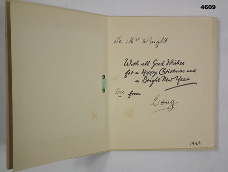 Inside of Christmas card with writing.
