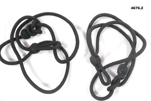 Two black uniform shoulder lanyards
