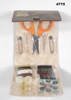 Sewing kit inside showing contents.