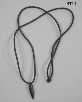 SLR round with green cord attached