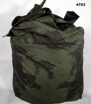Camouflaged military issue raincoat 1967