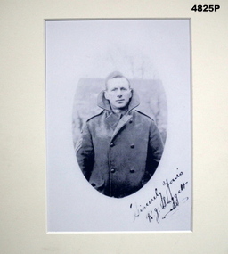 Portrait photograph in mount.