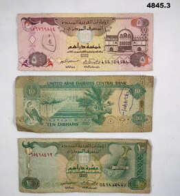 Three United Arab Emirates currency notes.