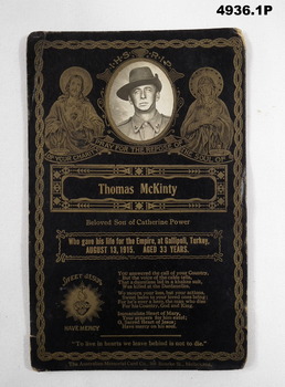 1.MEMORIAL CARD FOR THOMAS McGINTY.  2. Set of B & W PHOTOGRAPHS OF AUST L.H.. IN DESERT IN MIDDLE EAST.