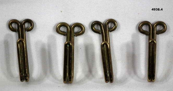 Brass keepers for a ceremonial belt.