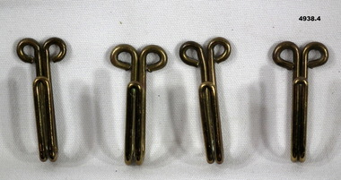 Brass keepers for a ceremonial belt.