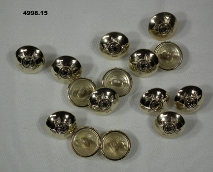 Small tunic button featuring a Christian army chaplain's insignia.