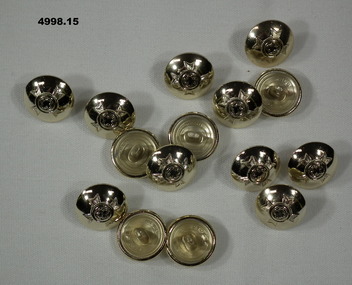Small tunic button featuring a Christian army chaplain's insignia.