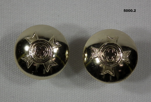 Pair of cuff links featuring a Christian army chaplain's insignia.