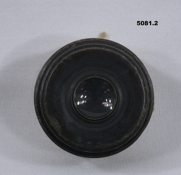 Black metal and glass camera lens.