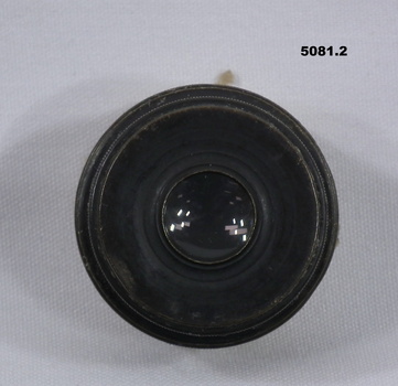 Black metal and glass camera lens.