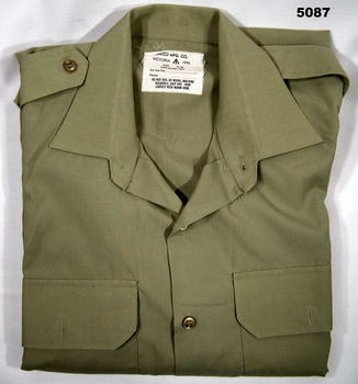 Khaki long-sleeved polycotton Australian Army shirt.
