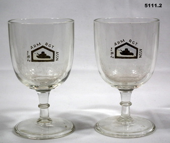 Two engraved wine glasses.