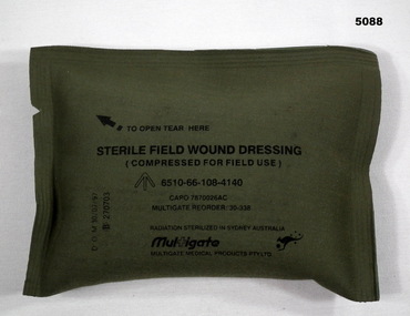 Sterile field wound dressing in unopened packet.