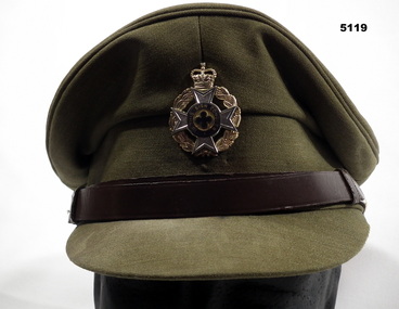 Officer's peaked cap with Christian Chaplain's badge.