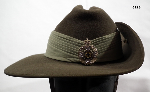 Australian Army slouch hat with seven fold puggaree and badges.