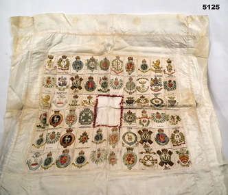 Cushion cover with regimental badges represented