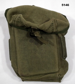 Khaki coloured, ammunition pouch with metal buckles and straps.