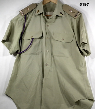 Short sleeved khaki polyester shirt with major's insignia.