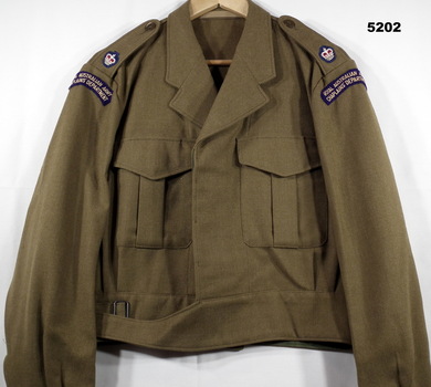 Khaki woollen battle dress jacket with cloth major's insignia and chaplain's badge.