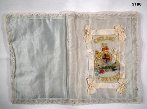 Embroidered silk handkerchief holder with "England for Ever" on it.