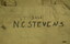 COTTON WEBBING BACK-PACK IN KHAKI. CLOSE UP OF NAME.