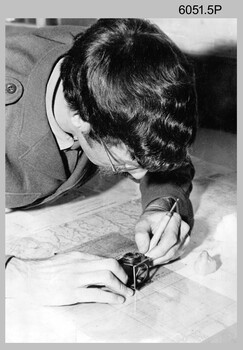 SGT Bob Scaddan retouching reproduction material at the Army Survey Regiment c1970s
