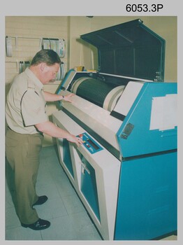CPL Mick Ellis operating the Optronics Scanner/Film Writer c1990s