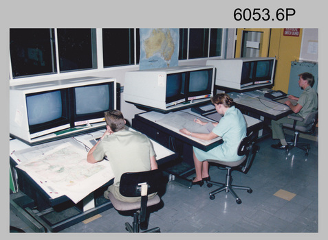 L to R: unidentified, SPR Rachel (Stanford) Scott, CPL Chris Wynn operating AUTOMAP 2 Graphic Edit Workstations c1994.