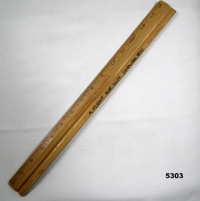 Wooden ruler in imperial measurements.