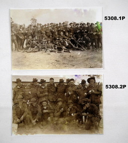 Black & White photos of soldiers having a cuppa, biscuit or icecream.