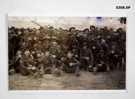 Black & White photos of soldiers having a cuppa, biscuit or icecream.