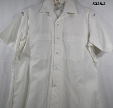 White shirt and shorts Navy uniform.