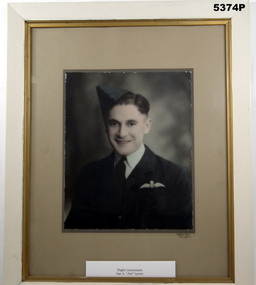 Framed coloured photograph of a uniformed RAAF airman.