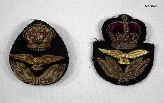 Two RAAF cloth cap badges.