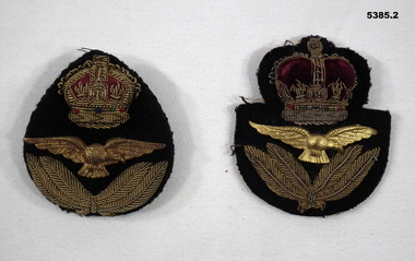 Two RAAF cloth cap badges.