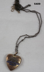 Trench art- brass heart shaped locket on chain, blue enamel writing.  Rising Sun Insignia 
