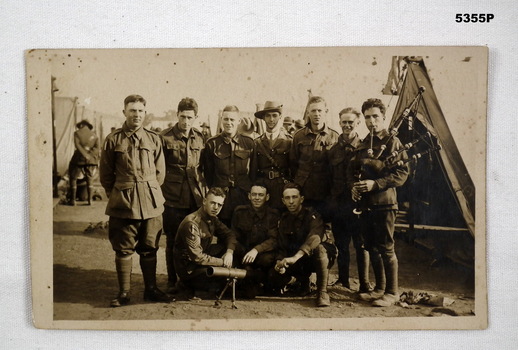 Black and white group Portrait of ten soldiers.