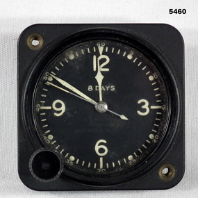 Square faced analogue clock for an aircraft.