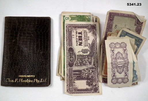 Wallet with various Japanese and Occupation currencies.