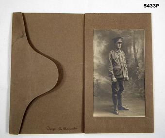Soldiers portrait mounted in a folding postcard.