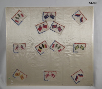 Flags of different countries embroidered on cram silk fabric 