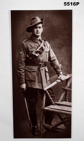 Portrait Photograph of a soldier standing.