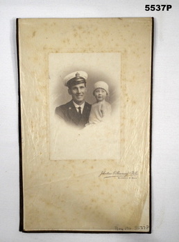 Photo of a Navy Officer with a child.