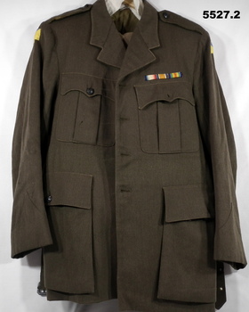 Tailored khaki officer's service dress jacket and jodhpurs.