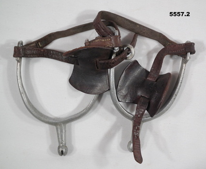 Military style aluminium spurs with leather straps and butterflies.