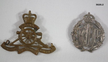 Two uniform badges, artillery and RAAF.