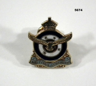 Gold coloured metal lapel badge with RAAF insignia.