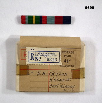 Service Ribbons on a bar in a cardboard box.